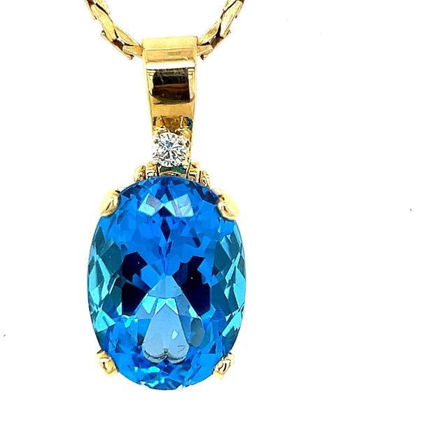 Oval Blue Topaz and Diamond Pendant in 14k Yellow Gold